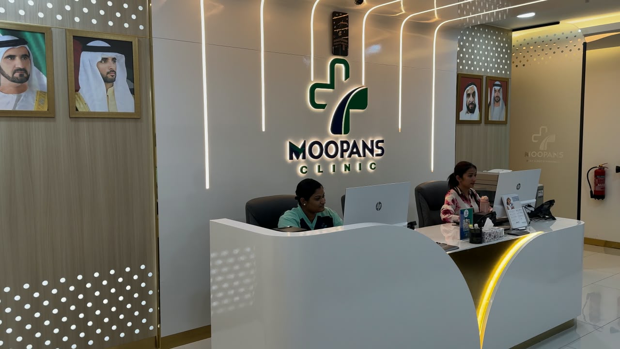 The reception team at Moopans Poly Clinic in Al Qusais, Dubai